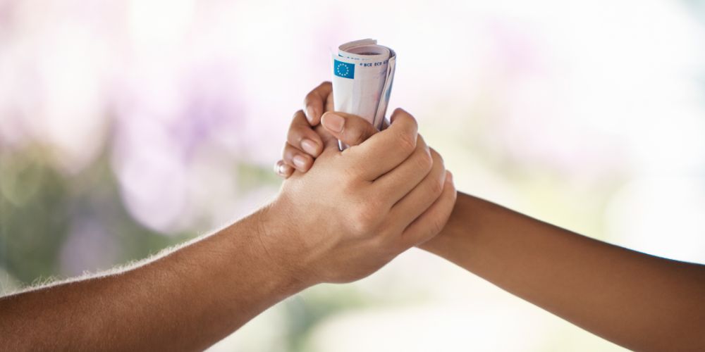 hands exchanging money