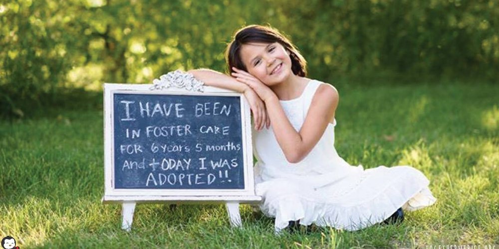 Young girl sit on the grass