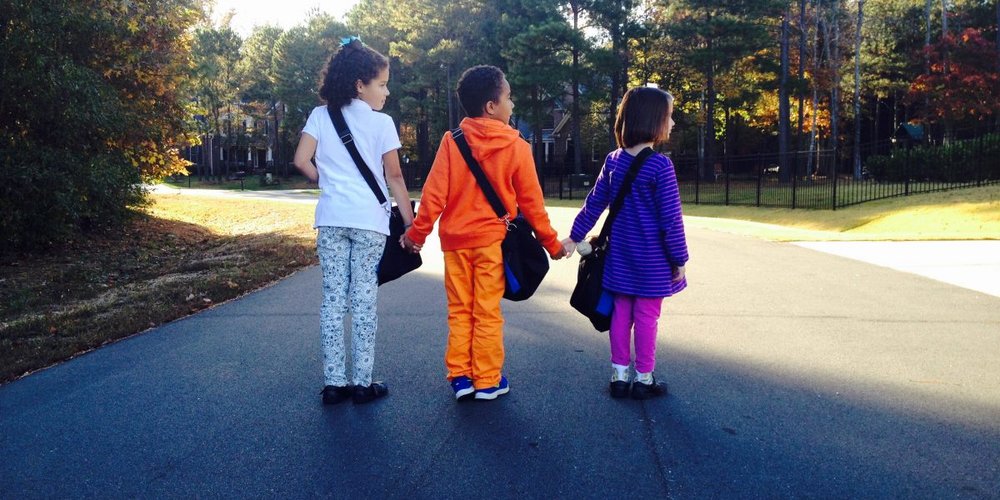 three little kids on the road