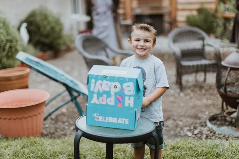 Kid holding a box