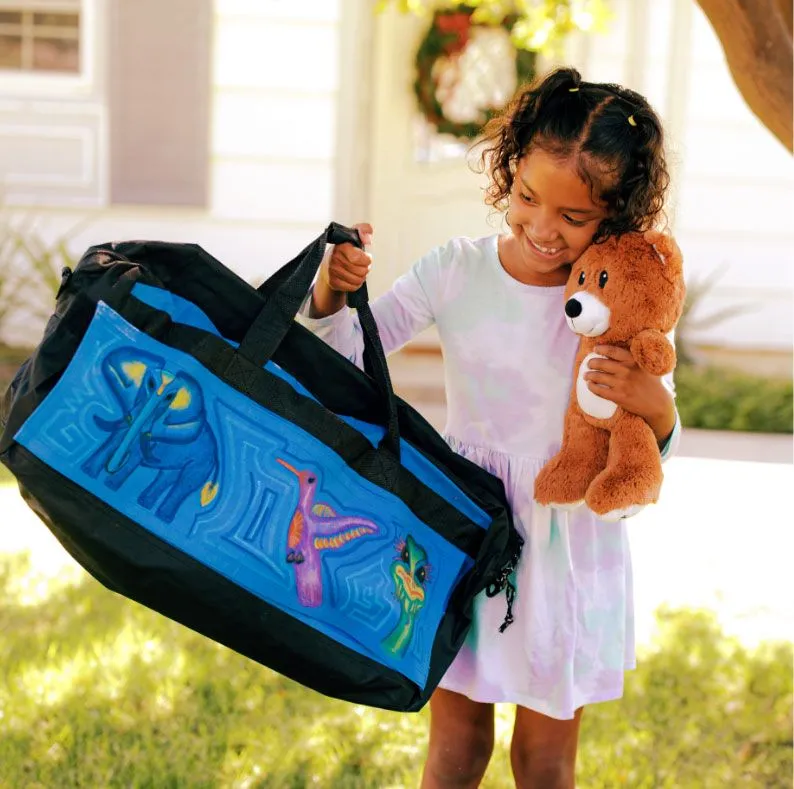 girl with bear holding up sweet case