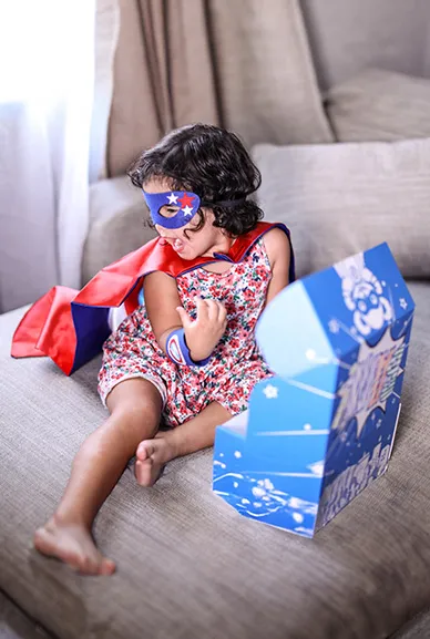 girl with superhero box