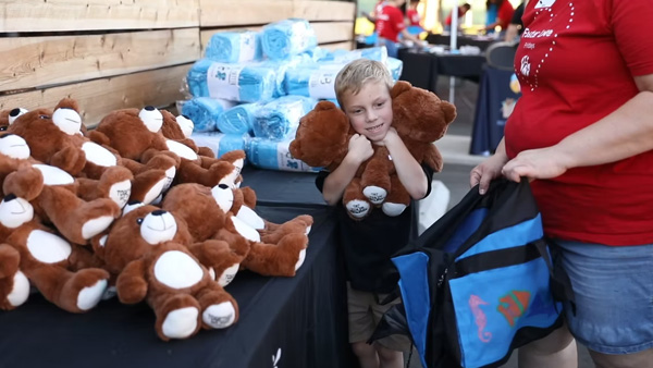 Kid helping with sweet cases