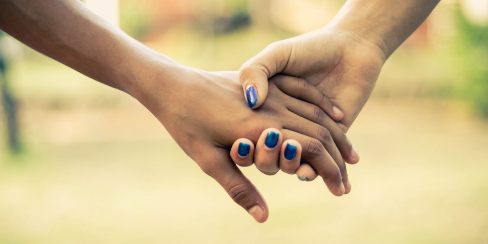 holding hands while walking