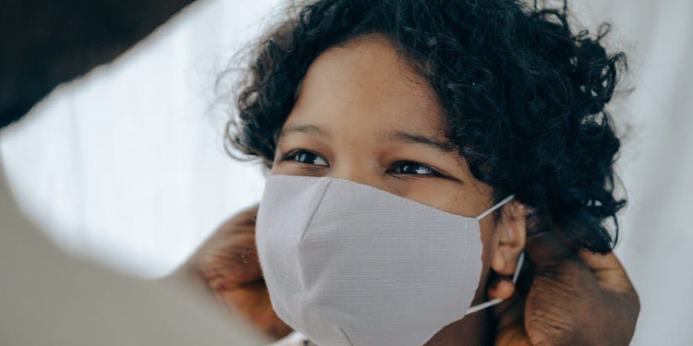 young boy wearing face mask