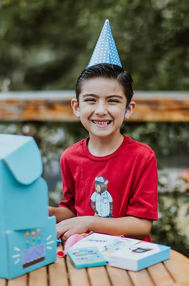 boy opening a birthday box