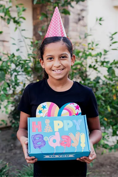 girl holding a birthday box