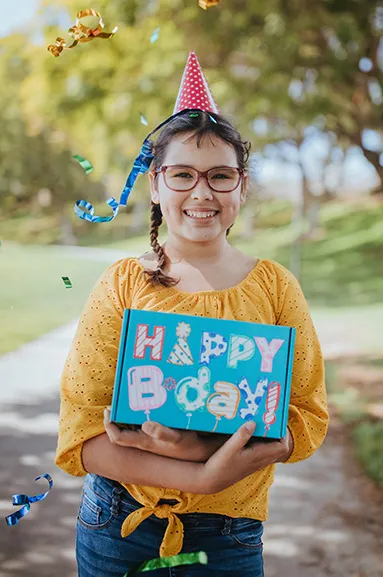 girl holding birthday box