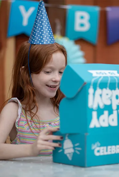 girl opening birthday box