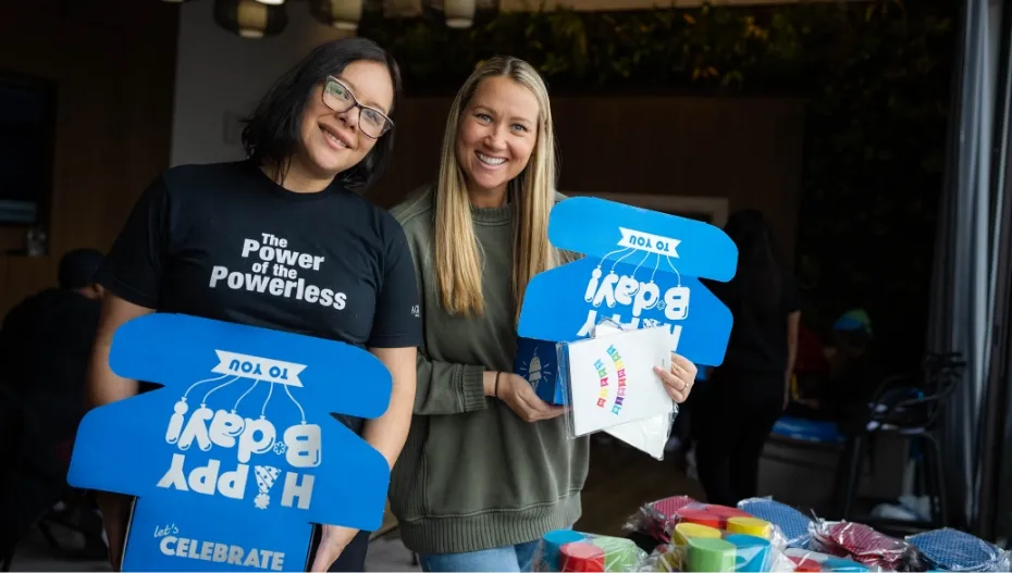 volunteers-holding-birthday-boxes