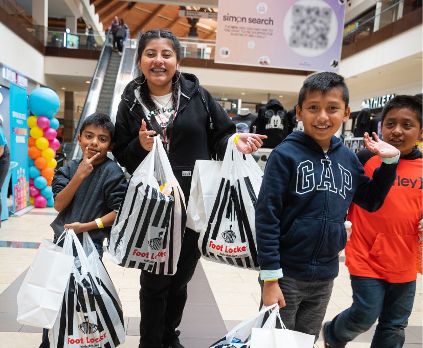 kids holding shopping bags