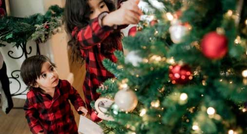 child looking at the Christmas tree