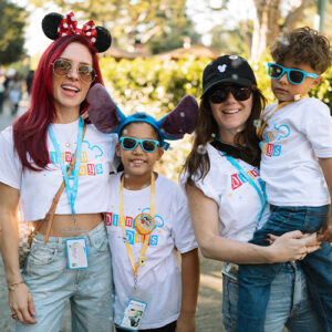 kids post with a Disneyland volunteer