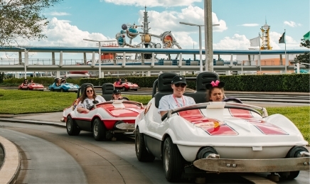 Kids at Walt Disney World riding cars
