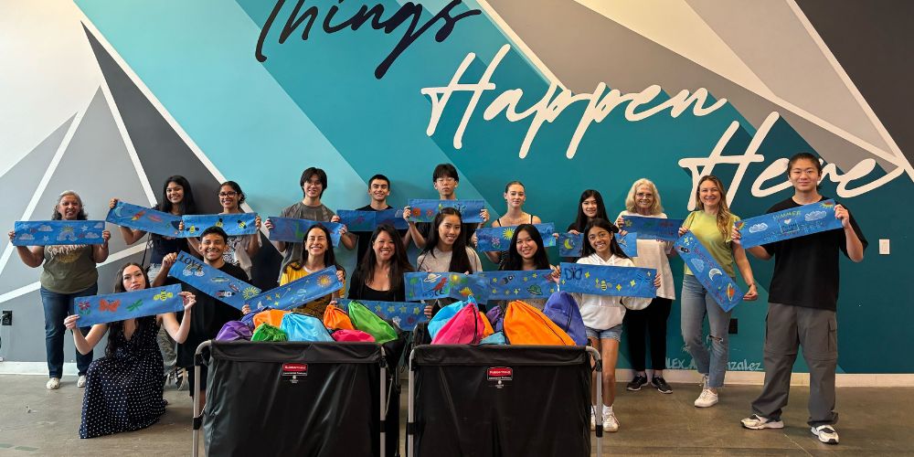 Volunteers with their completed summer fun kits