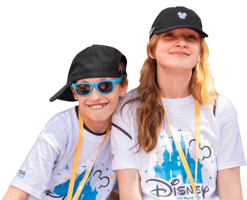 two cool siblings posing in Disney Days shirts