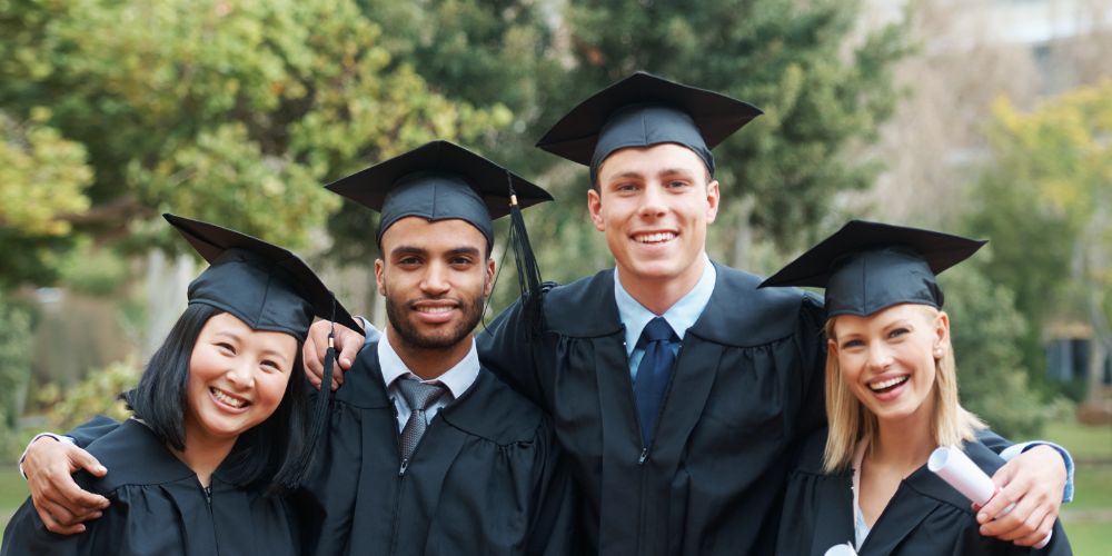 new grads in cap and gowns