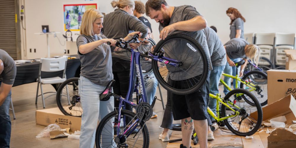 volunteers building bikes