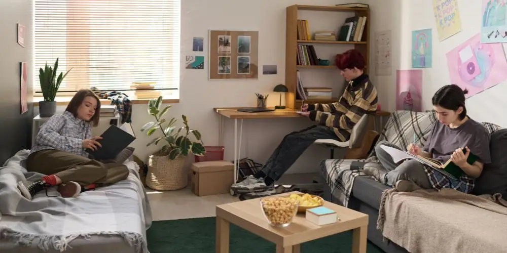 students relaxing in their dorm room