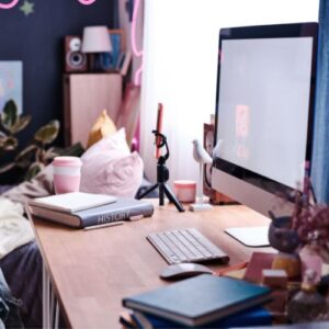 college dorm desk with a computer and decor