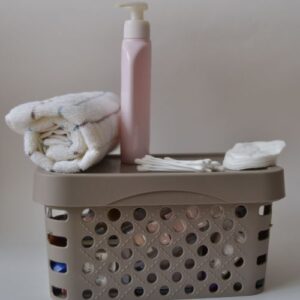 a shower caddy with soap and towels