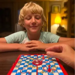 boy playing board game
