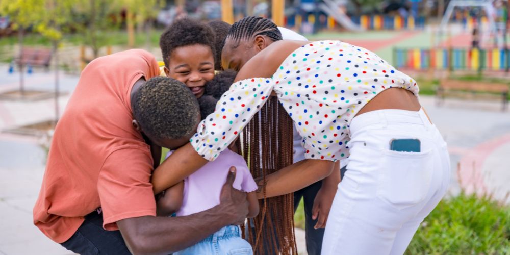 family hugging after reunification