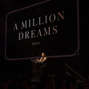 Gianna speaking at the Believe foster love gala in 2024