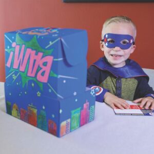 child with his open superhero kit