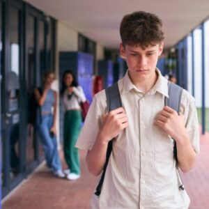 Boy being made fun of in school halls