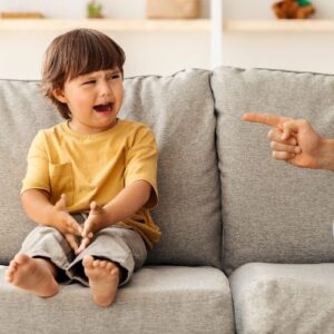 boy getting scolded