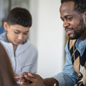 man mentoring a child
