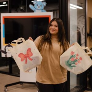 woman holding up her completed Foster Love holiday service activity