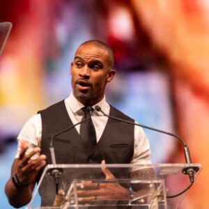 Anthony Trucks speaking at the Foster Love Believe Gala