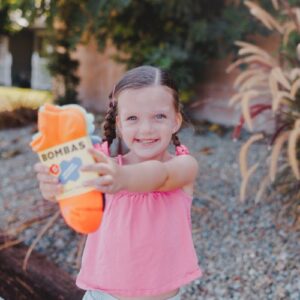 girl holding up socks for socktober