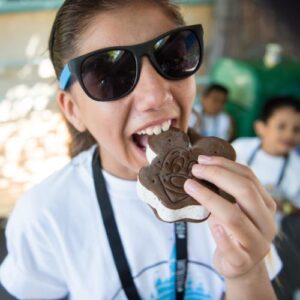 Girl eating Mickey ice cream
