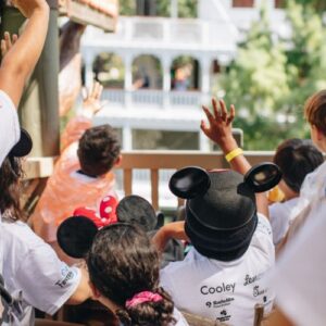 Kids waving to parade