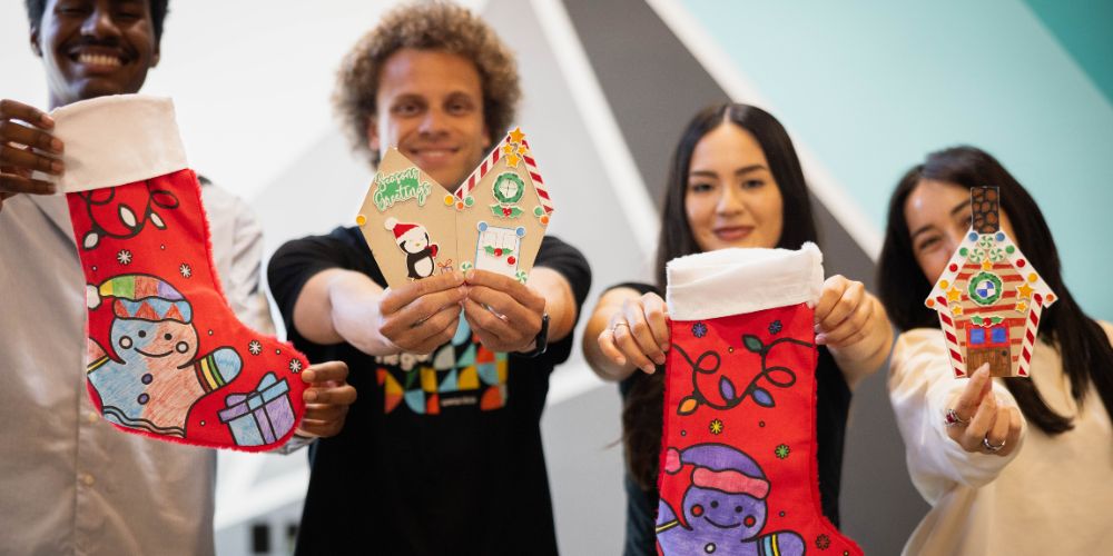 Employees holding their holiday service activity