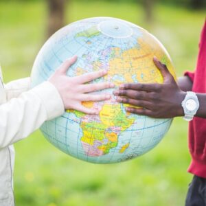 two hands holding a globe