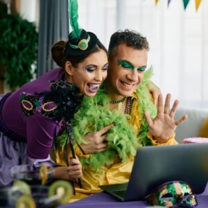 two employees taking part in workplace halloween games online