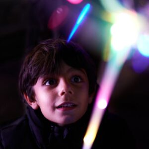 kid on Halloween with glowstick