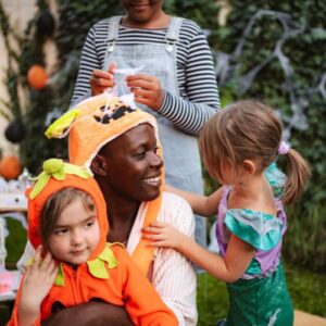 Mom and kids at a Halloween party