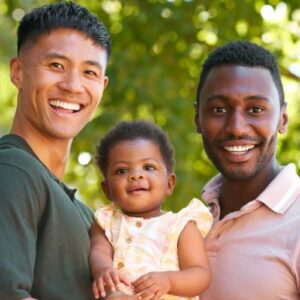 two dads with their son