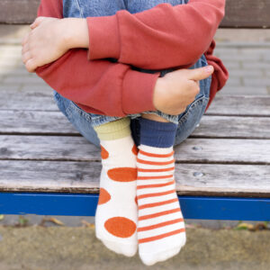 Child wearing mismatched socks