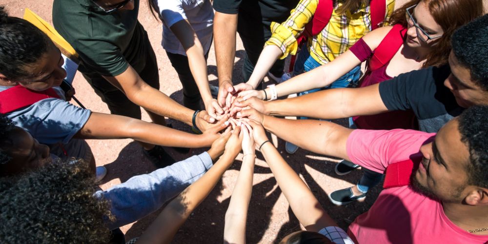 hands gathered for giving tuesday