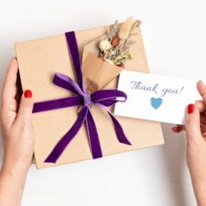 A decorated box with a tag that says thank you