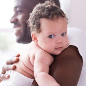 man hugging his baby