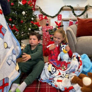 Kids opening presents on Christmas morning