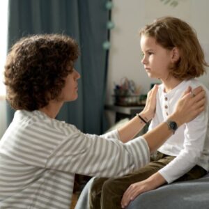 A daughter and mother having a serious conversation about abuse