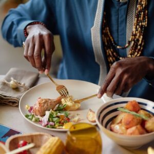 Man eating Kwanzaa dinner
